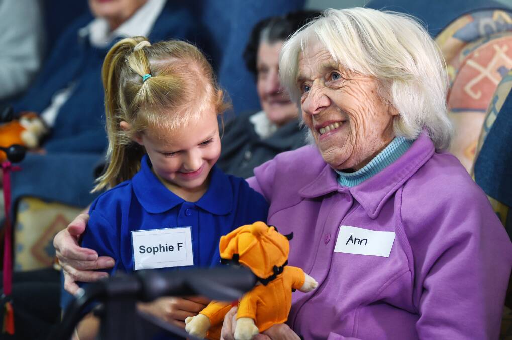 FRIENDS: Sophie and Ann formed an instant bond when Black Hill Kindergarten visited Pineview Residential Care for the first in a 10-session series of visits. Picture: Kate Healy