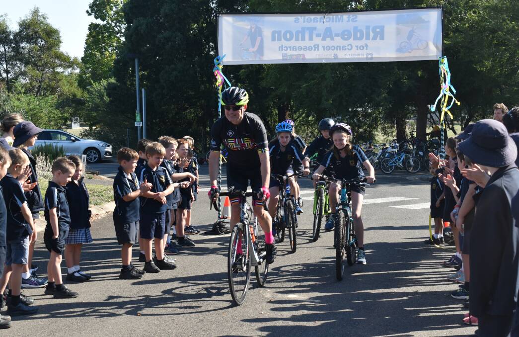 START: Jim Waight leads off the first wave of the St Michael's Primary ride-a-thon. Picture: supplied