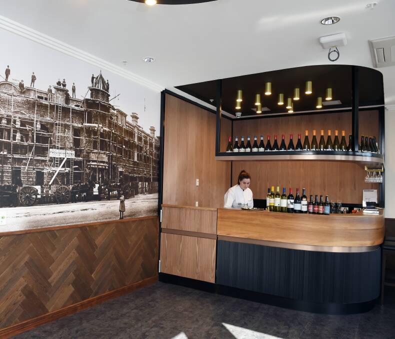 DRINKS: The bar, complete with historic pub photos from around Ballarat and a view toward Black Hill, at Mercy Place. 