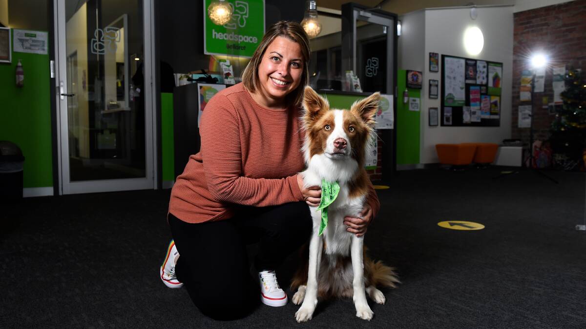 GOOD THERAPY: headspace therapy dog Fly with his owner, psychologist Julie Jammet. Picture: Adam Trafford