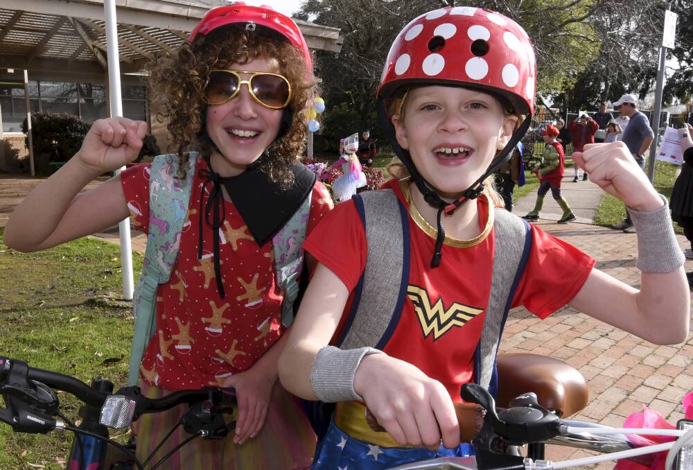 Grade six students Scarlett and Jessie jumped on their bikes to join in the fun at school. Picture: Lachlan Bence