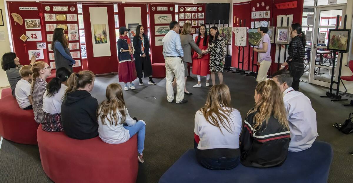 VISITING ART: Artists from the Chinese Contemporary Women Artists' Association show off their artwork and share their inspiration with staff and students from Mount Clear College.