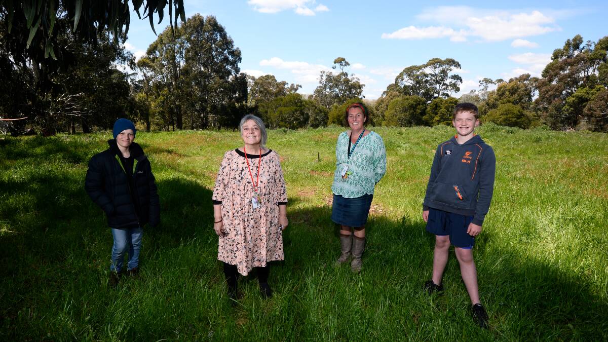 SPACE: Manu (left) and Cooper (right) with Green Team Leaders Lizzie Woodroofe (second from left) and Eirinn Taylor (Sustainability Leader). in the area where a carbon sink will be established and the space wattles planted at Daylesford Secondary College. Picture: Adam Trafford