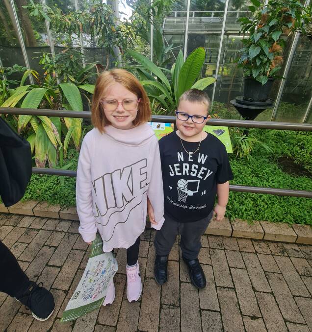 WARM: Caleb and sister Jessica at the Butterfly House at Melbourne Zoo. Picture: supplied
