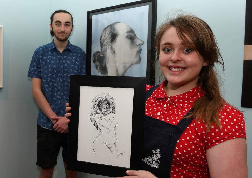 ARTISTIC TALENT: Local student artists Patrick Staley and Tahlia Stanton, who finished year 12 last year, with their artwork on display in the 2018 Next GEN exhibition at the Art Gallery of Ballarat. Picture: Lachlan Bence