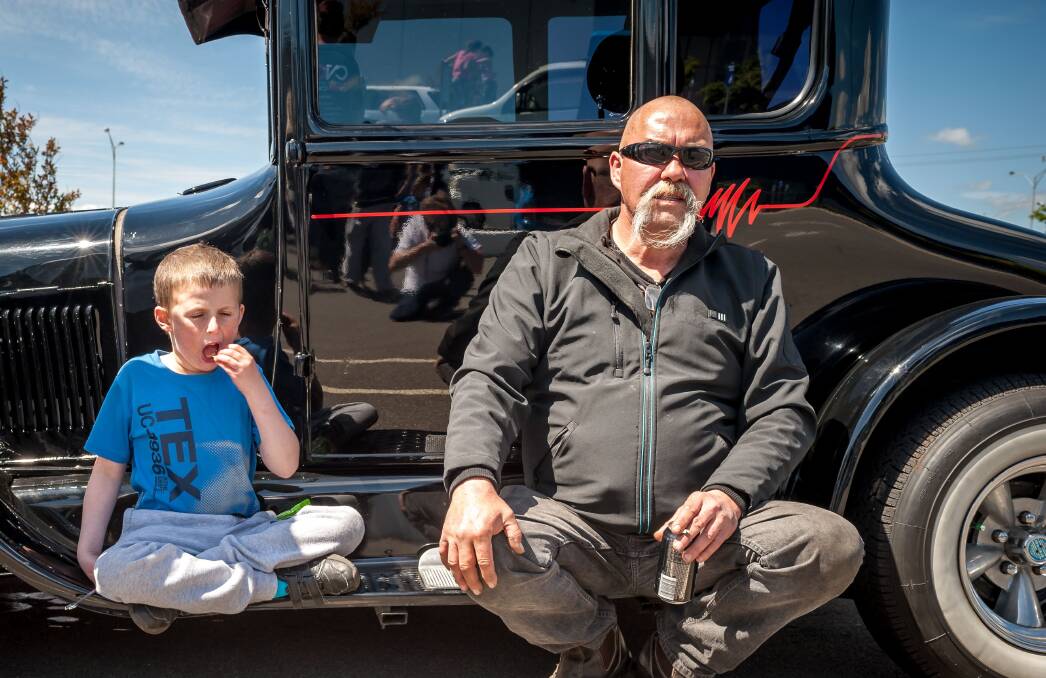 CRUISING: Kayle takes a break for a snack with his grandfather Colin Bowen during the weekend's Cruise for Kayle fundraiser. Picture: Allan Griffin
