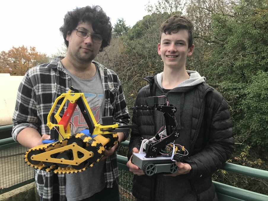 READY FOR BATTLE: John and Alex are hoping to get a Ballarat Area Robotics League off the ground so robot builders can test their skills against each other. Picture: Michelle Smith