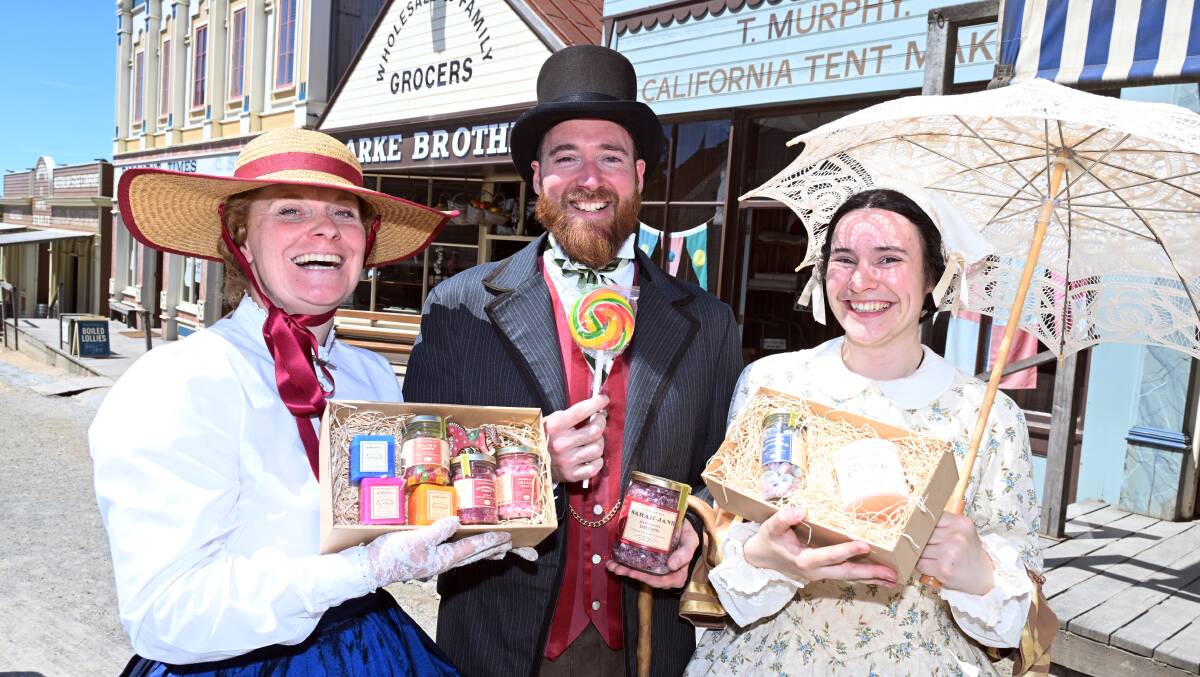 Claire Brown, Tim O'Keefe, and Kirily Mortem with some of the goodies available on Sovereign Hill's annual Christmas Shopping Night on November 24. Picture by Kate Healy