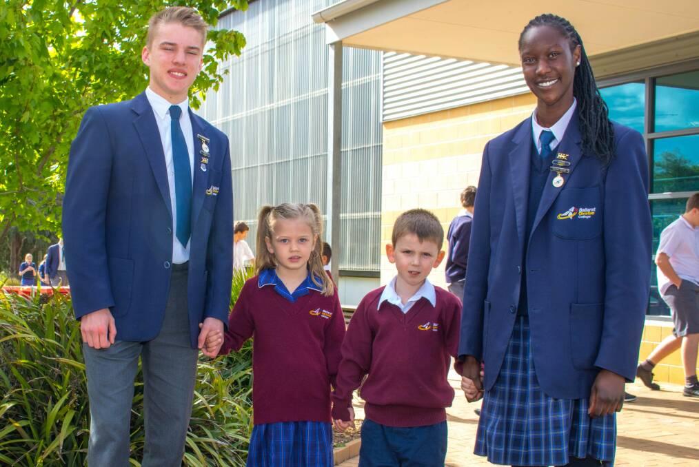 LAST DAY: Ballarat Christian College year 12 captains Tom and Nyaruot with their prep buddies Olivia and Isaac.