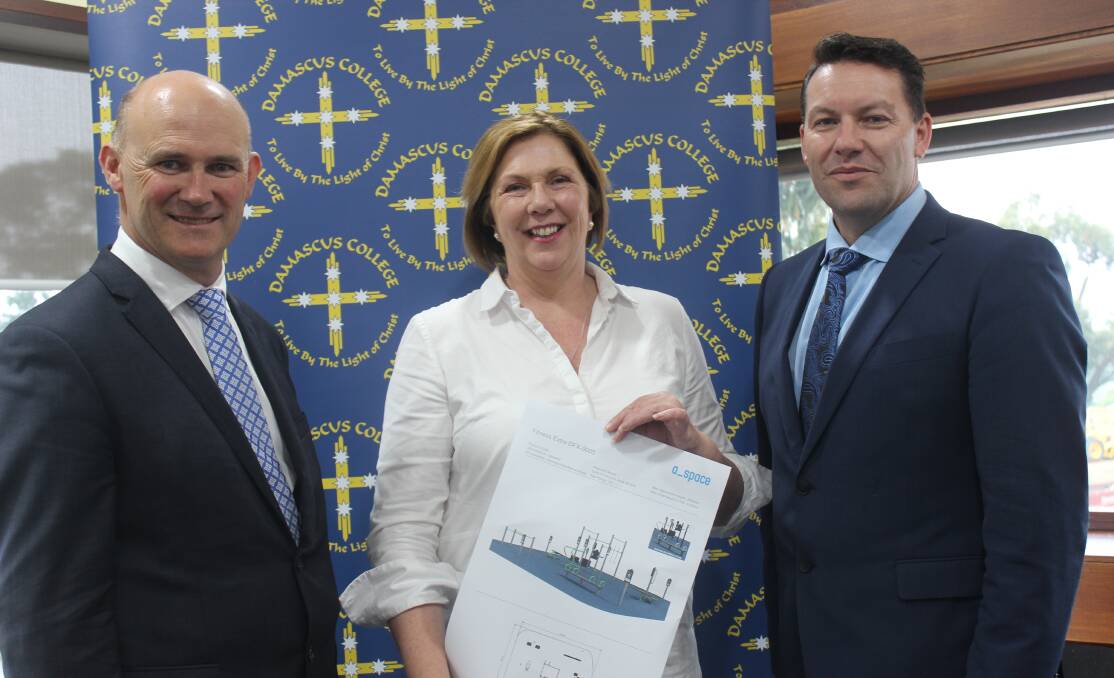 GET FIT: Damascus College principal Matthew Byrne, Ballarat federal MP Catherine King and Damascus business manager Paul Jans with plans for the new outdoor fitness equipment. Picture: supplied