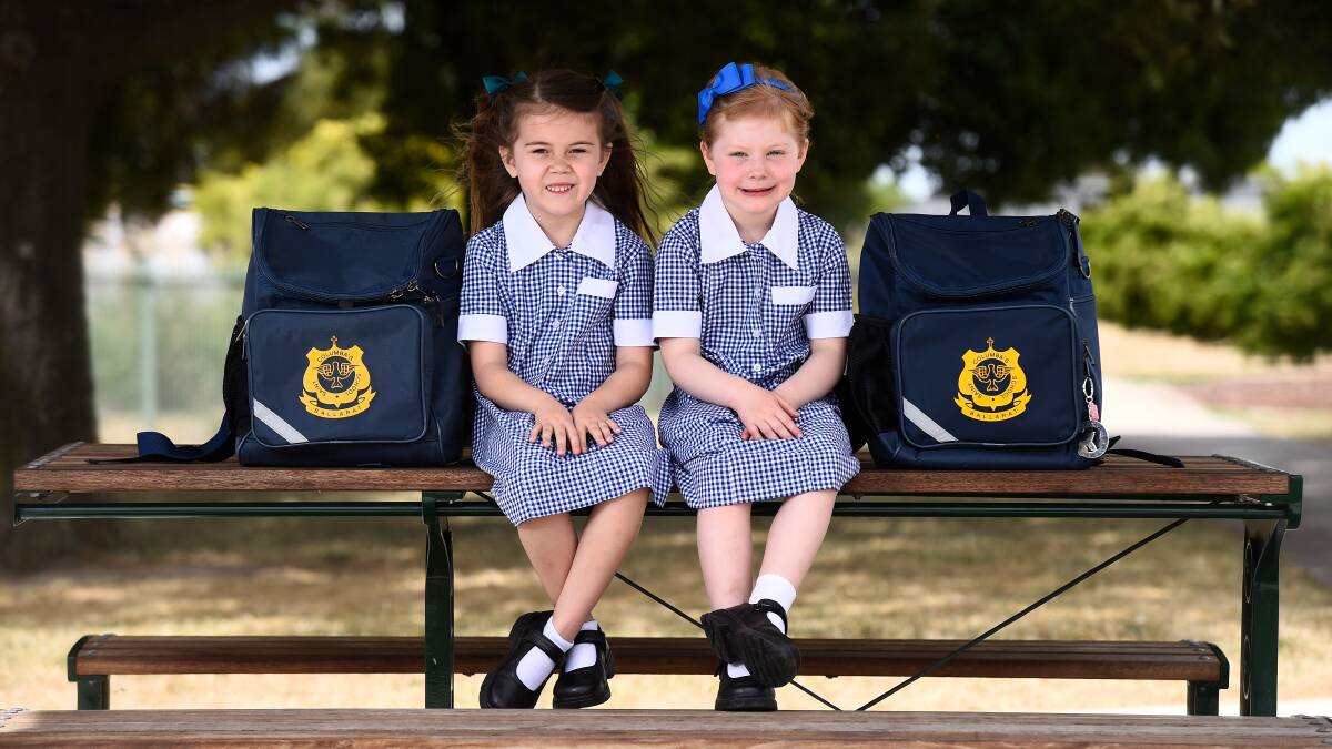 Friends Harriet and Georgie are ready with their bags packed to start school this week. Picture by Adam Trafford