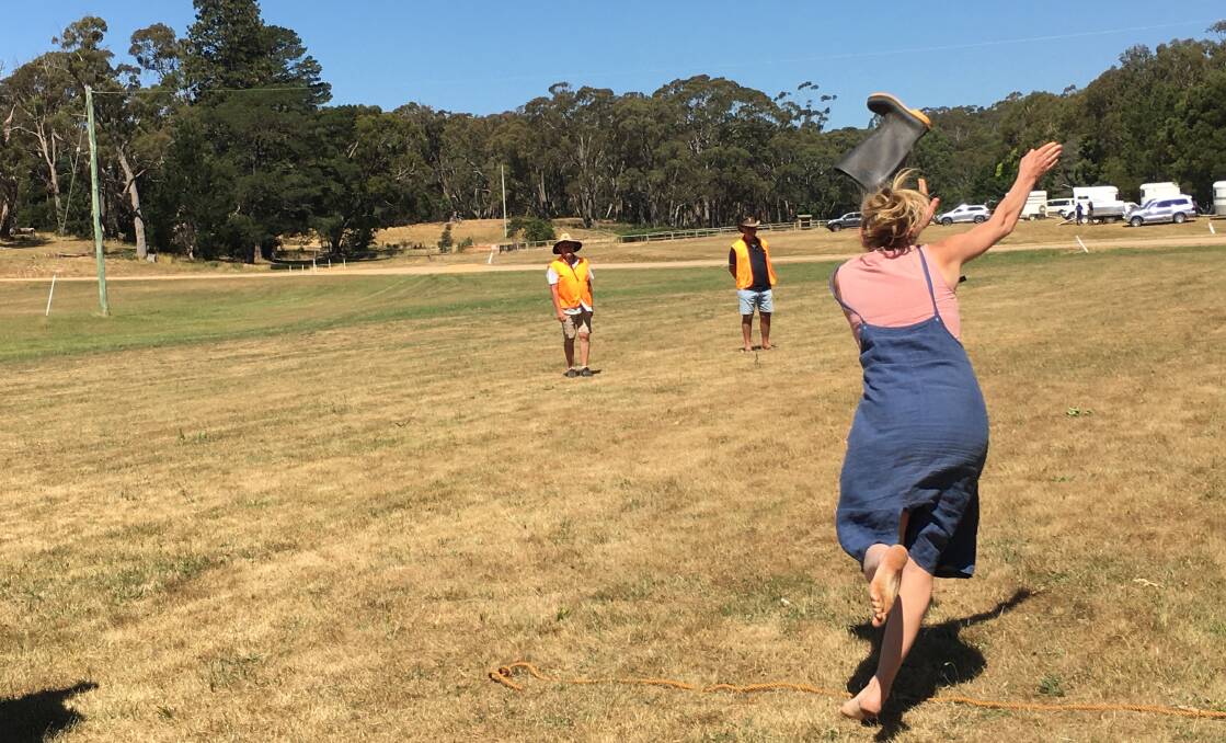 Ladies tested their might in the gumboot throwing competition. Picture: Evan Davis