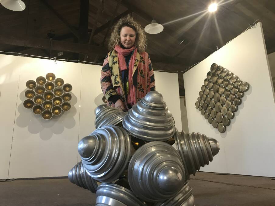 KITCHEN ART: BOAA venue manager Felicity Martin with the kitchenware creations of Brisbane sculptor Donna Marcus. Picture: Michelle Smith