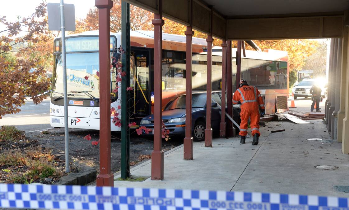 CRASH: A verandah was damaged after a runaway bus and car collided on Warrenheip St, Buninyong, near the bus stop, in June last year. Picture: Kate Healy