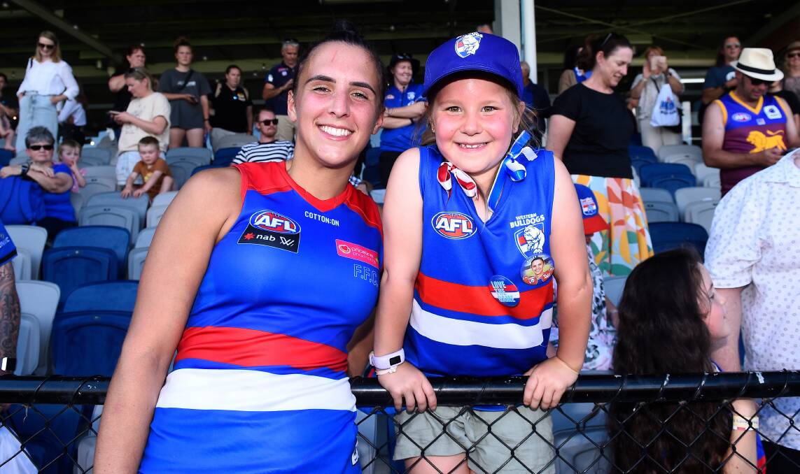 GRINNERS: Mackenzie meets her favourite player Bailey Hunt of the Western Bulldogs after the game.