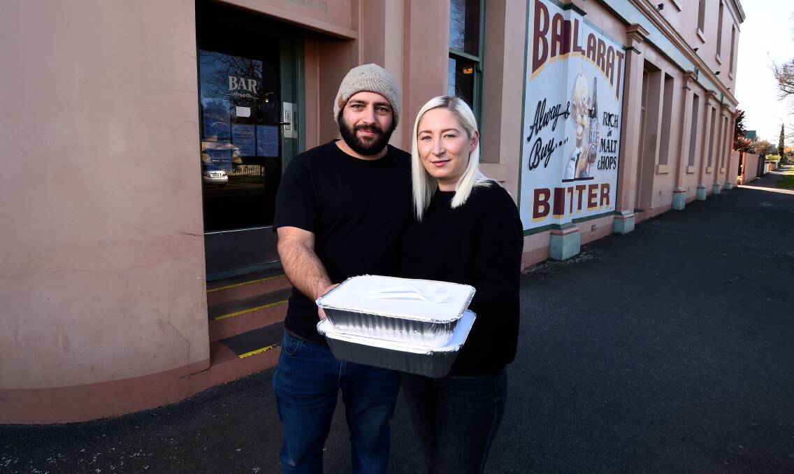 BRAVE FACE: Royal Oak hotel owners Gigi Milone and Dean Mangion have turned to offering take-away meals to get through lockdown. Picture: Adam Trafford