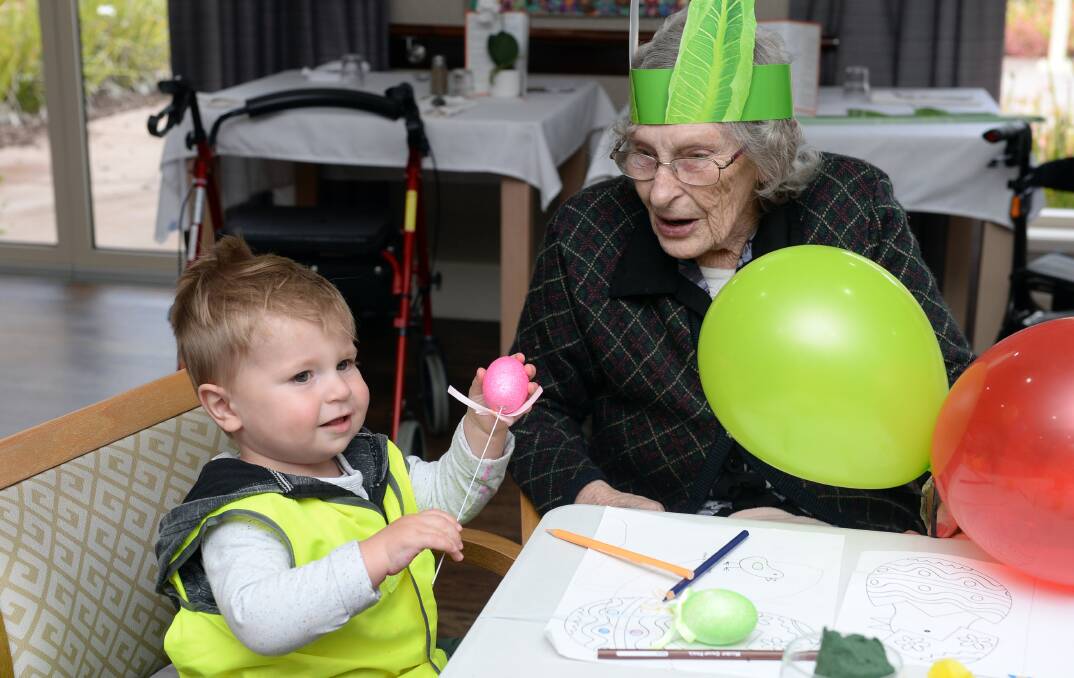 Jack, 18 months, spends time with Phyllis Carter at BUPA Delacombe. Picture by Kate Healy