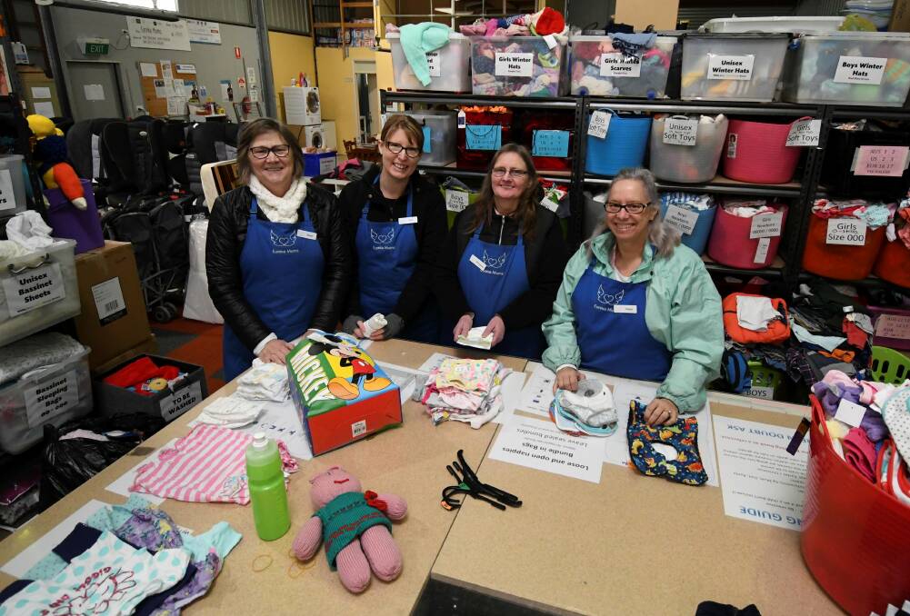 HELPERS: Eureka Mums volunteers Sheryl Wereszozuk, Sally Rothberg, Bernedette Cahill and Cheryl Bennett at the group's Sebastopol warehouse. Picture: Lachlan Bence