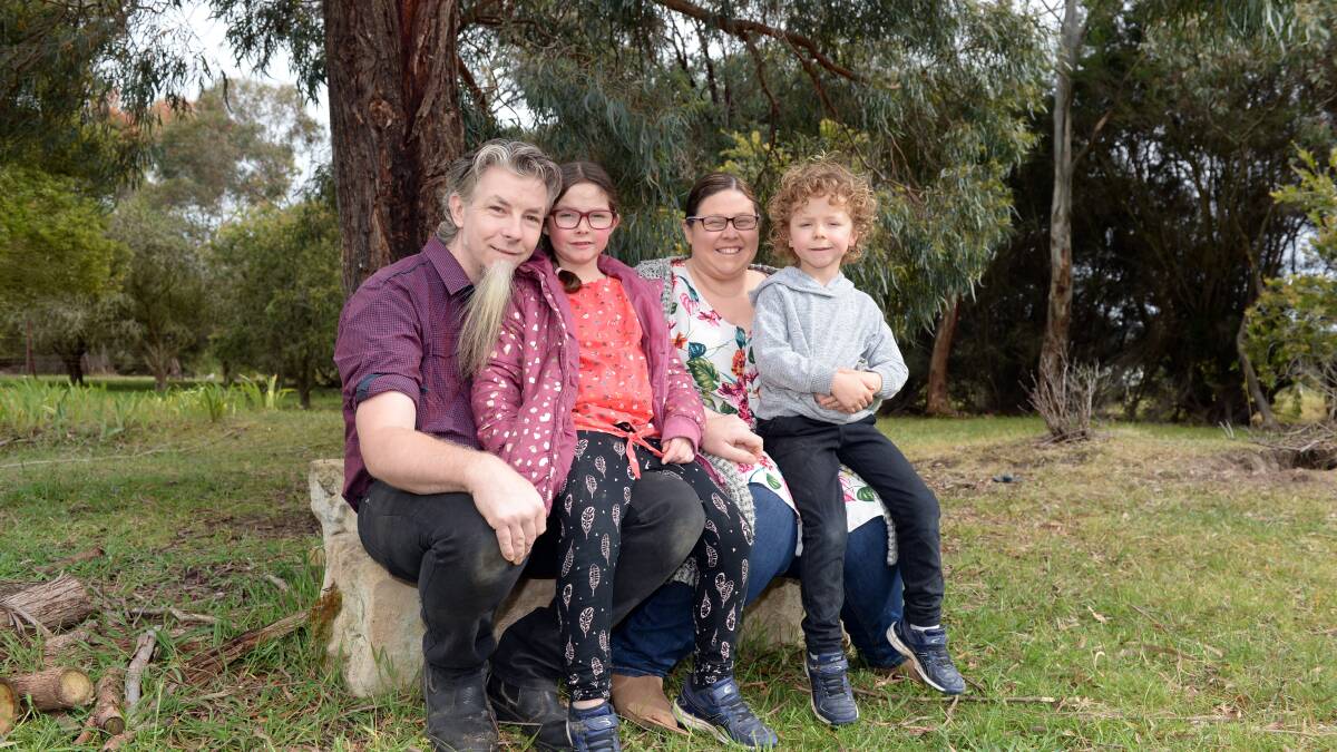FAMILY: Deon, Shelby-Anne, Nicole and Oliver Mackay relax at home. Picture: Kate Healy