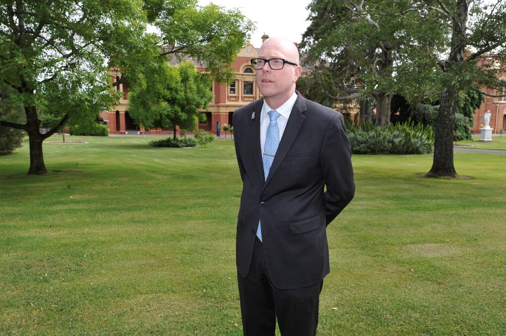SHIFT: Outgoing St Patrick's College principal John Crowley, who took up his new position as headmaster at troubled St Kevin's College on Thursday. Picture: Lachlan Bence