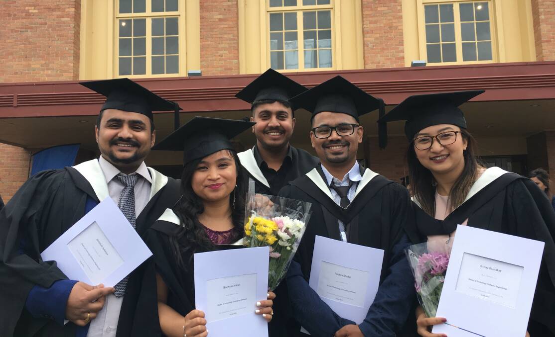 DONE: These international students were among more than 500 students to graduate from Federation University and Federation TAFE at ceremonies at Civic Hall this week. Picture: supplied