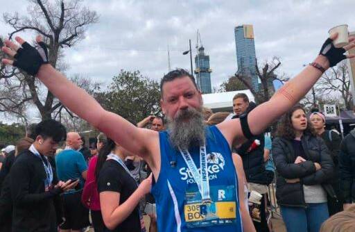 FIRST EVENT: Bob Carey-Grieve celebrates after crossing the finishing line of the Run Melbourne event last year. 