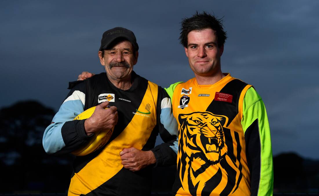 PROUD: Brett Cook (right) can't wait to get out on the football field with his dad John for the first time ever. Picture: Adam Trafford