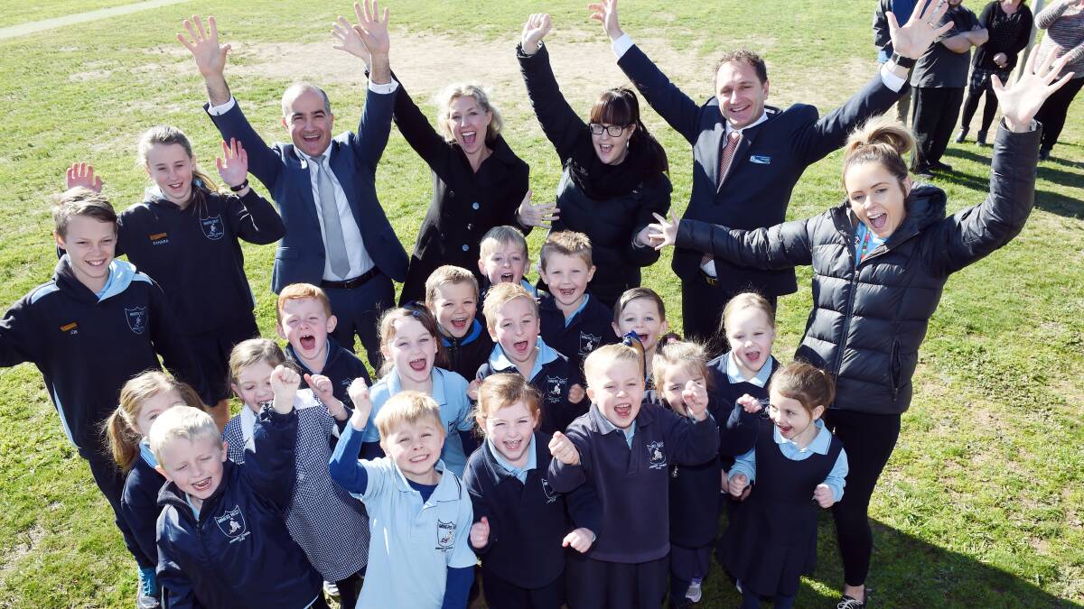 Education minister James Merlino celebrates at Miners Rest Primary School during the 2018 election campaign after promising funding to redevelop the school. Picture: Kate Healy