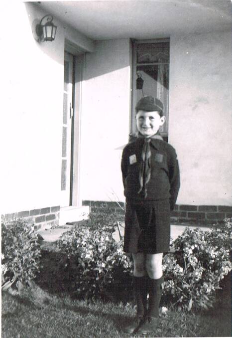 New home: Paul Jennings in his cub uniform at age seven soon after he arrived in Australia.