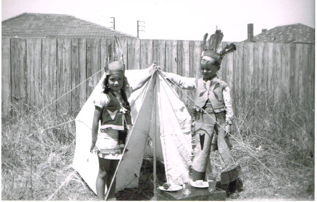Fun: Paul Jennings and his sister Ruth play with their Christmas present in the 1950s - an Indian tent and outfits.