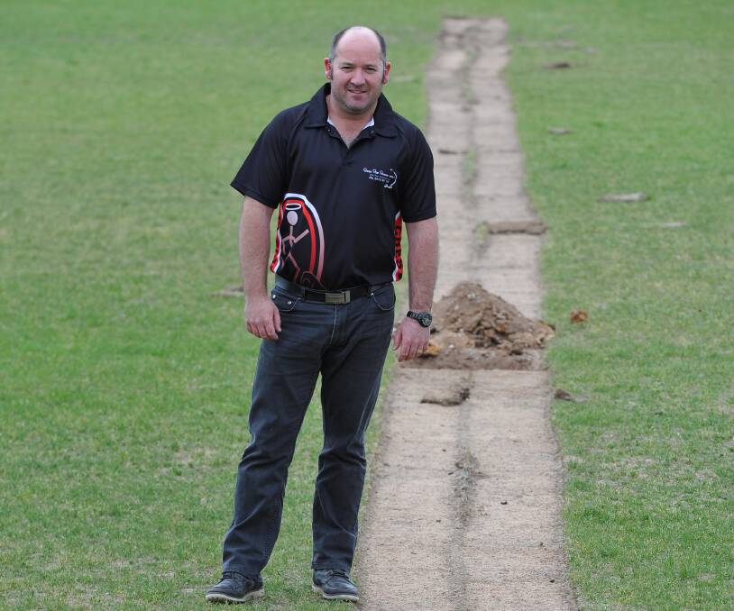 DRAINAGE SAGA: Creswick Football Netball Club president Mick Alsop, pictured during drainage upgrade works in 2015. 