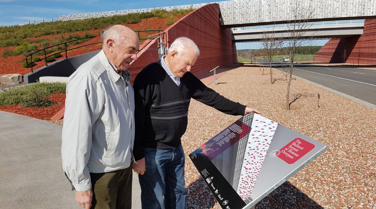 Historic: Avenue of Honour committee president Bruce Price and fellow Avenue of Honour member Paul Jenkins observe the new interpretive signage.