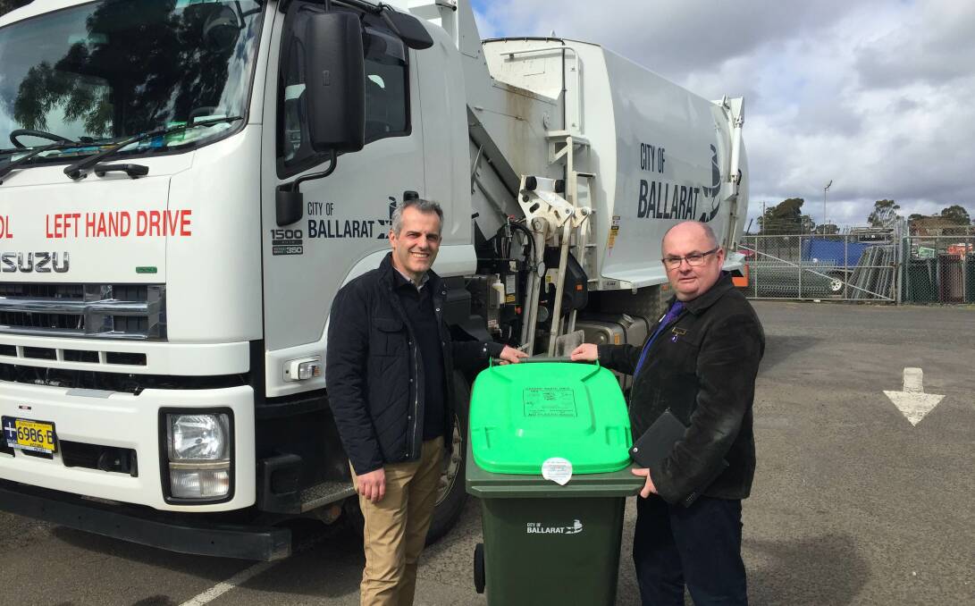 Going green: Sustainability Victoria chief executive Stan Krpan and City of Ballarat mayor Des Hudson with one of the city's new green bins.