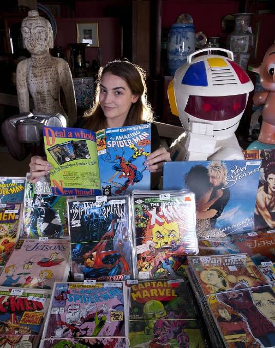 UNDER THE HAMMER: Lauren Baudinette of the Glenelg Auction Centre with some of the quirky array of collectibles up for auction this weekend.
