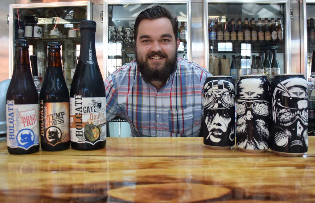 BATTLE: Hop Temple's manager Zac Hill shows off some of the selected craft beers which will be judged by Ballarat. Picture: Alicia Thomas.
