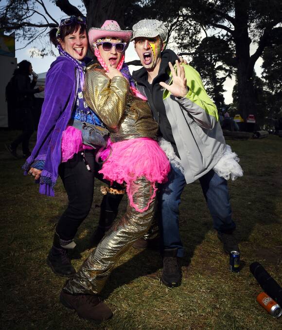 COLOURFUL: Sara Casey, Don Corleone and Adam Jackson were among thousands who dressed up during the 25th Meredith Music Festival. Picture: Luka Kauzlaric.