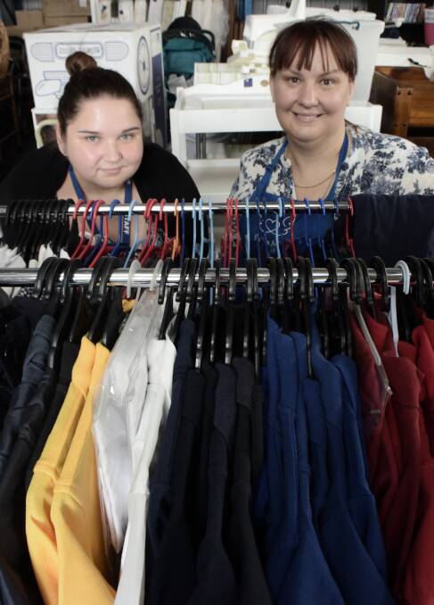 DONATIONS: CAFS family services case manager Amanda Rosenthal and Eureka Mums secretary Trinsa Lewis with a donation of uniforms. Picture: Alicia Thomas.