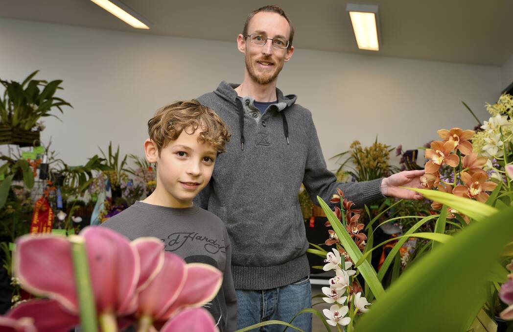ORCHID GROWERS: Ballarat Orchid Club member Brad Haywood and his son Oscar, 12, at the 2016 Ballarat Orchid Show. Photo: Dylan Burns