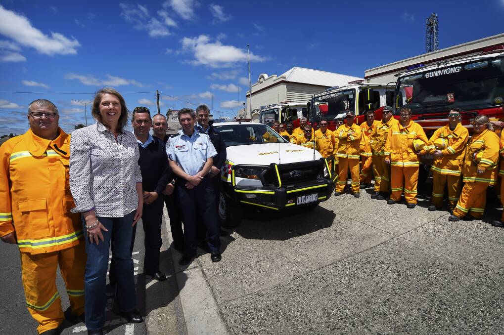 NEW VEHICLE: Steve Burgess with Catherine King MP, Alistair Cuzens, Malcolm Bruce, Bill Cook, David Walker and members of the Eureka CFA Group at the launch of the Eureka Group FCV at the Sebastopol Fire Station on Sunday. Picture: Luka Kauzlaric.  