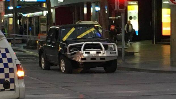The car at the corner of Bourke and Swanston streets after the crash. Photo: Joe Armao.