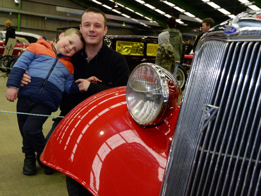 FUN: Fyfe Young, 3, and Chris Young from Ballarat celebrate Father's Day at this year's Mechanica car and bike expo. Picture: Kate Healy.