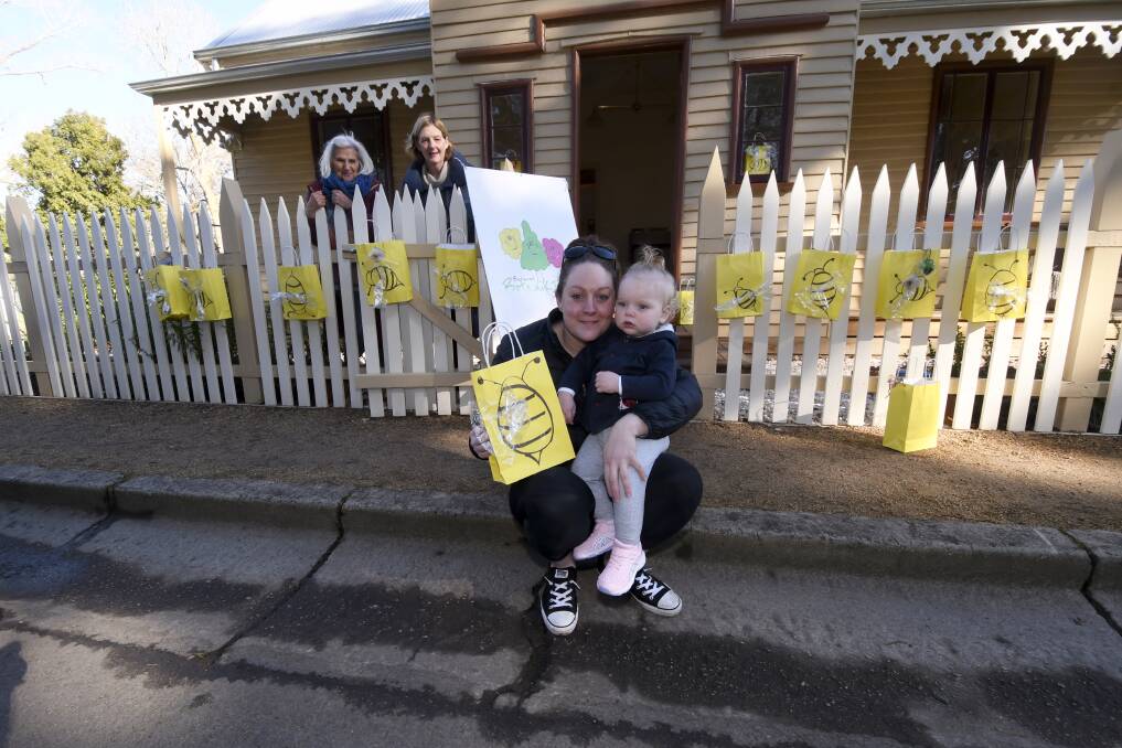 Botanikids' Julie Bradby and Heather Boyd are providing Bee Friendly packs to to children like 12 month old Eden and mother Tamara Glenkiron. 