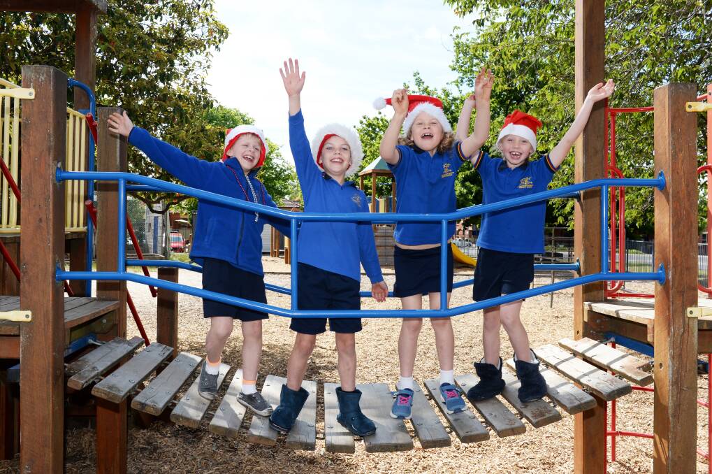 CHRISTMAS CHEER: Pleasant Street Primary School grade one pupils Henry, Jack , Poppy and Anna are looking forward to the Christmas festivities. Picture: Kate Healy 
