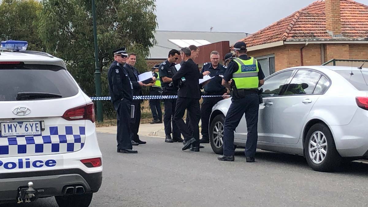  POLICE INVESTIGATION: Officers stand outside Tamara Farrell's house in February, 2019. 