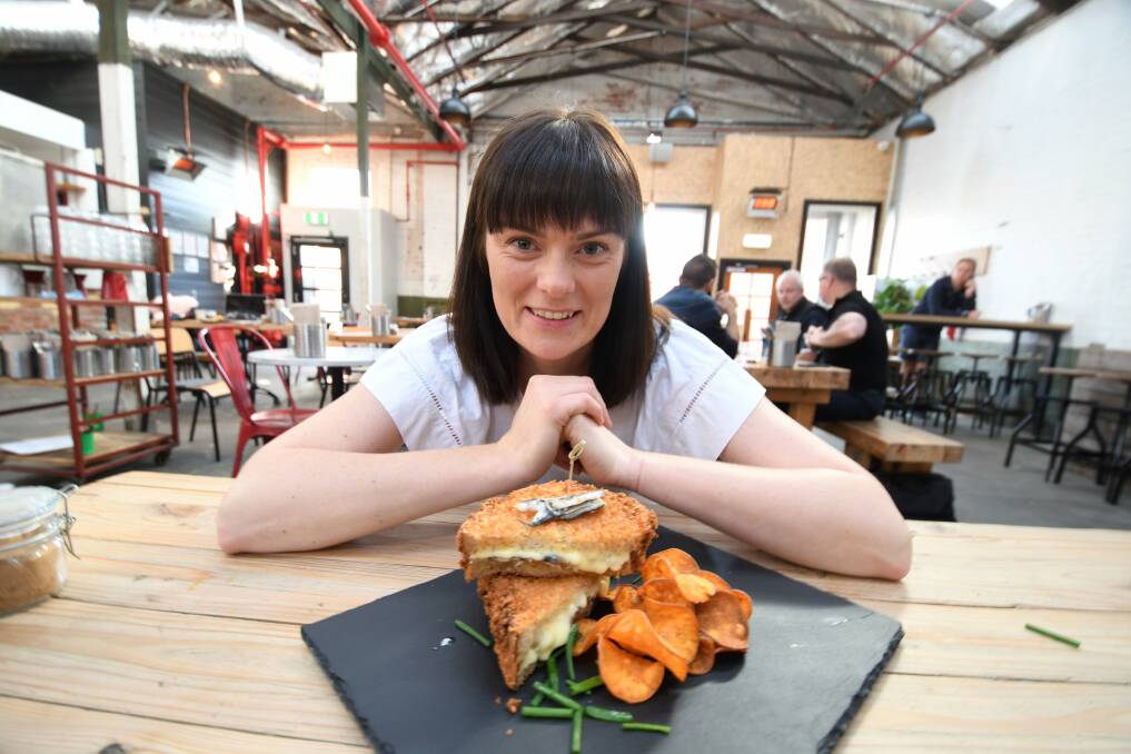 AMERICAN STYLE: Hydrant Food Hall owner Elise Rowe with their Mozerella in Carrozza toastie. Picture: Lachlan Bence 