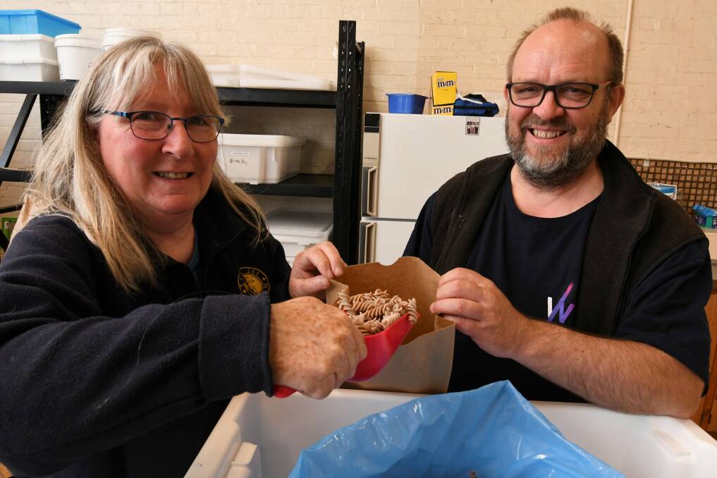 PASTA: Paul Duggan and Jill Clarke fill a paper bag with spelt pasta from Powlett Hill at the opening day of the Buninyong Community Collective. 