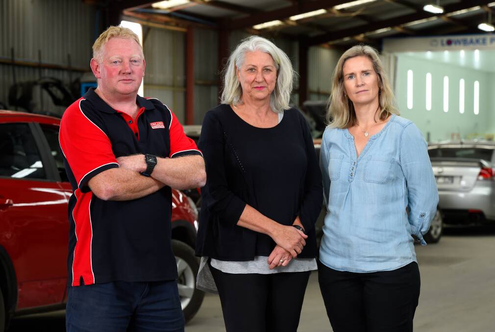 WAITING: Jailed Gold Bus driver Jack Aston's workplace Inland Motor Body Works has his job waiting for him when he is released. His wife Wendy Aston (middle) with Mick and Sam Murphy of Inland Body Works. Picture: Adam Trafford 