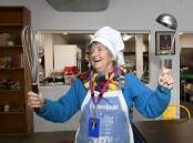 SERVING UP JOY: Breezeway volunteer Lynden Nicholls says it is important to bring a bit of fun to her work for the benefit of other volunteers and visitors. Picture: Lachlan Bence 