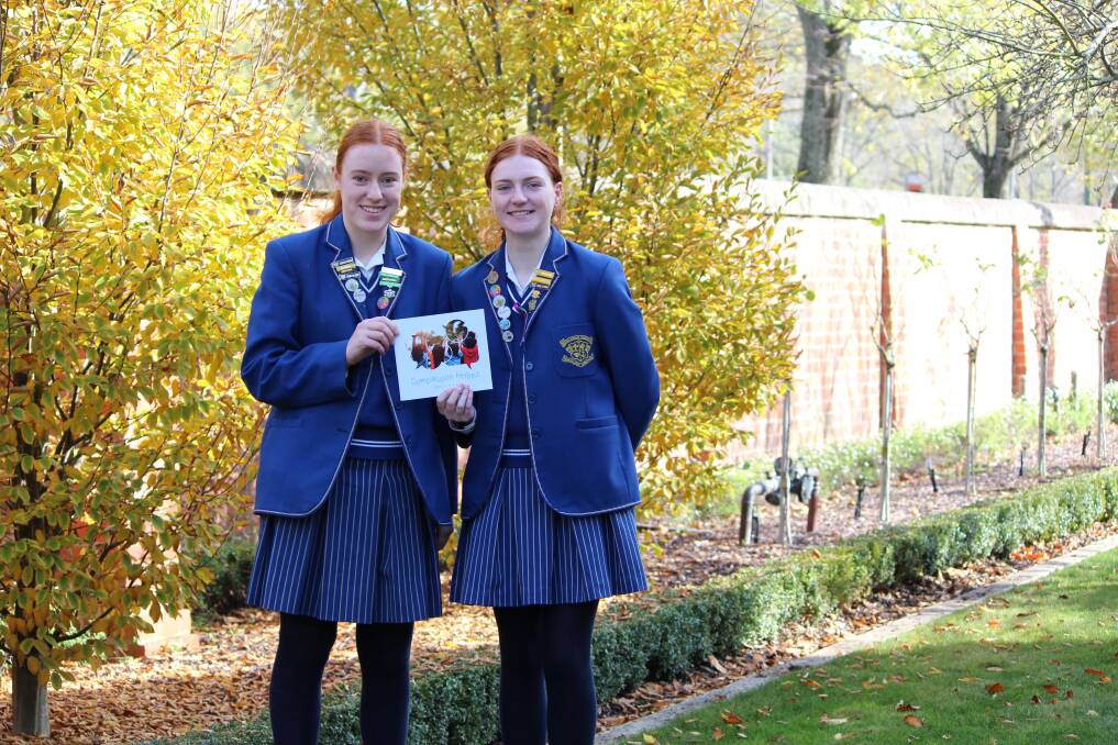 INSPIRE: Loreto College Year 12 students Ella Hansen and Davin Murray are creating the 2022 Compassionate Heroes Ballarat book. Picture: Rochelle Kirkham 