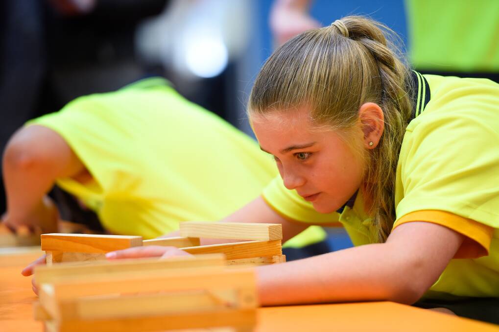 FOCUS: Caitlyn focuses on getting her planet box just right during Creswick Primary School's Hands on Learning program. Picture: Adam Trafford 
